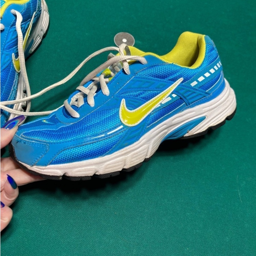 Vintage.  Hardly worn.  Women nike size 7.5 initiator blue glow voltage style